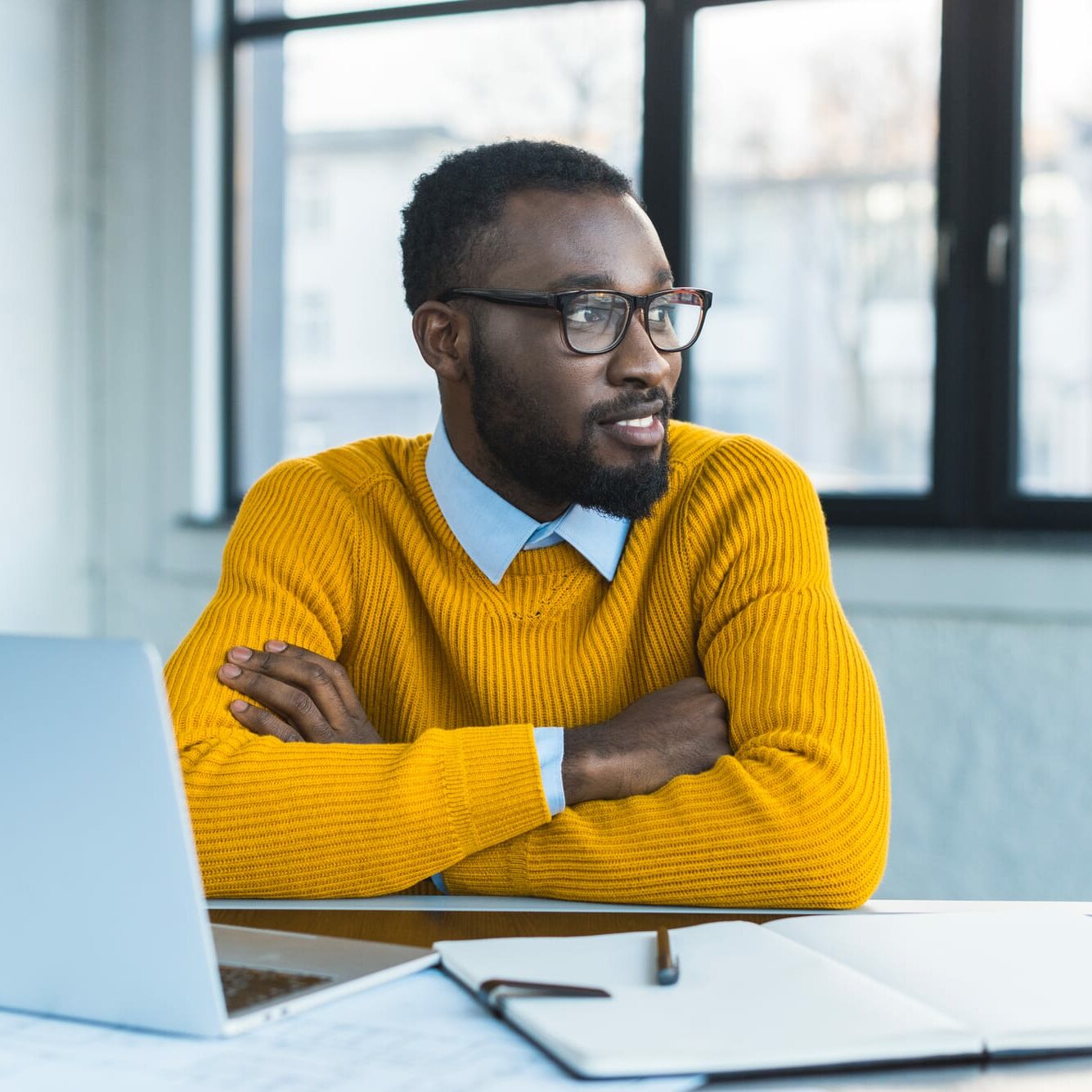 Man smiling in office space