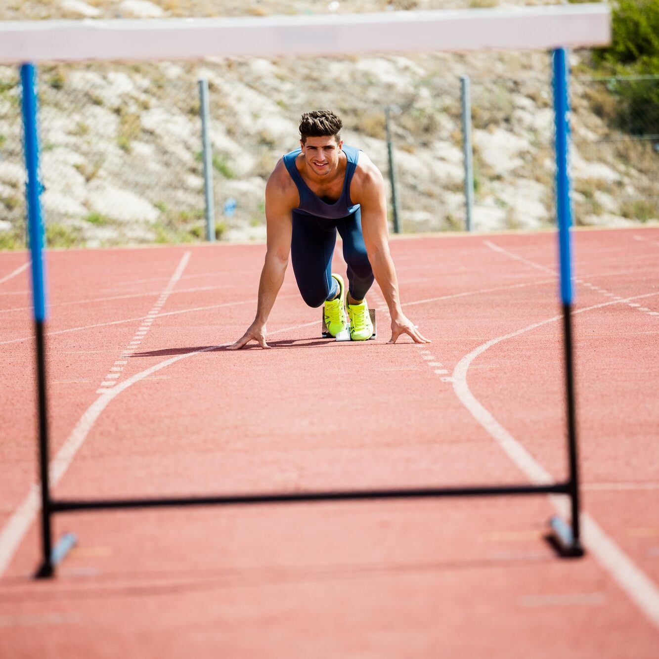 track athlete in starting stance