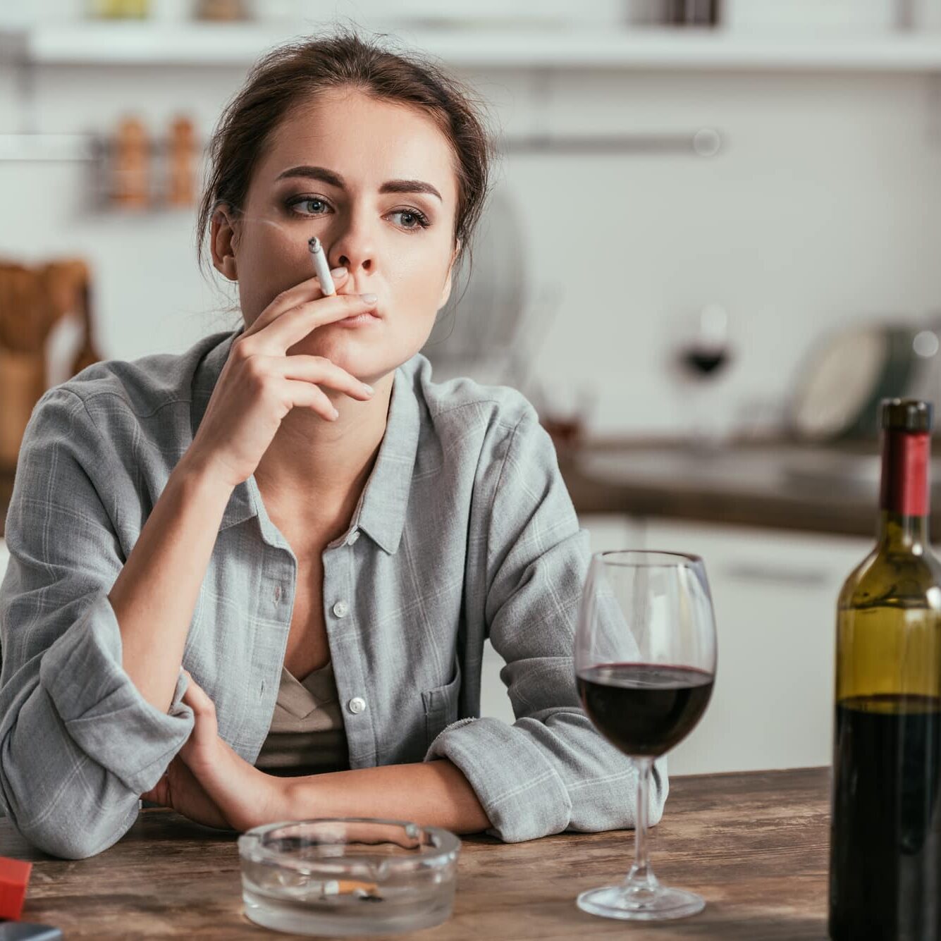 woman smoking and drinking wine